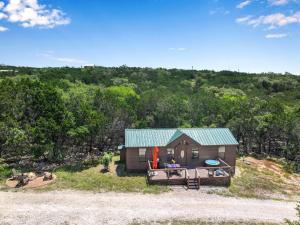 an overhead view of a small house with a green roof at Terlingua at the Bend in Wimberley