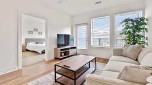 a living room with a couch and a tv at Beltline 1 bdrm Apt in Atlanta