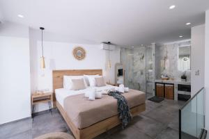 Postel nebo postele na pokoji v ubytování Aphrodite Luxury Accommodation