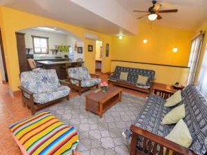 a living room with couches and chairs and a table at La Hacienda San Felipe Condo 10 in San Felipe