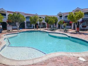 a large swimming pool in front of a building at La Hacienda San Felipe Condo 10 in San Felipe
