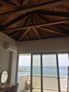 a room with a view of the ocean at Filanthi CostaS in Stoupa