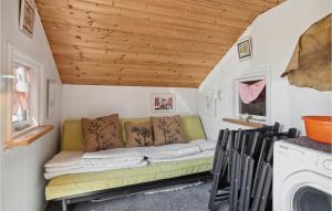 a room with a couch in a tiny house at 2 Bedroom Lovely Home In Rm in Kongsmark