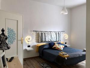a bedroom with a blue bed in a room at Il melograno in Usini
