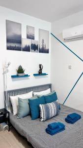 Postel nebo postele na pokoji v ubytování PMP Adamia Apartments