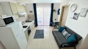 Kuchyň nebo kuchyňský kout v ubytování PMP Adamia Apartments