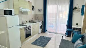 Kuchyň nebo kuchyňský kout v ubytování PMP Adamia Apartments