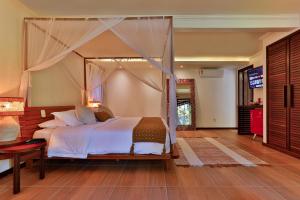 Cama ou camas em um quarto em Paraíso Ecológico Pousada & SPA