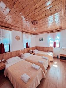Postel nebo postele na pokoji v ubytování Hotel Domino
