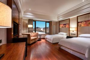 Postel nebo postele na pokoji v ubytování Sheraton Changbaishan Resort + 30 fotografií