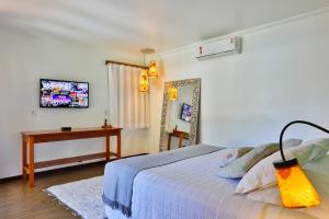 Cama ou camas em um quarto em Paraíso Ecológico Pousada & SPA