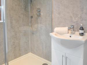 a bathroom with a shower and a sink at The Alnwick Townhouse in Alnwick