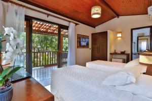 Cama ou camas em um quarto em Paraíso Ecológico Pousada & SPA