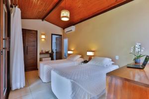 Cama ou camas em um quarto em Paraíso Ecológico Pousada & SPA