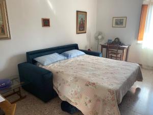A bed or beds in a room at La Mandola
