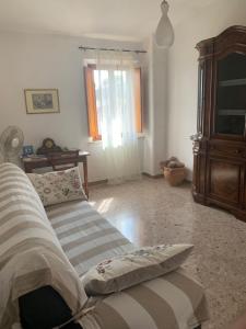 A bed or beds in a room at La Mandola