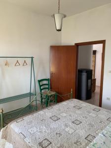 A bed or beds in a room at La Mandola