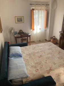 A bed or beds in a room at La Mandola
