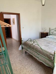 A bed or beds in a room at La Mandola