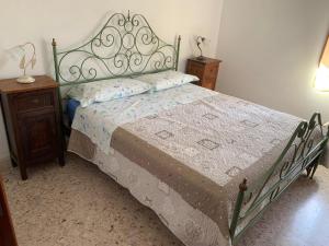 A bed or beds in a room at La Mandola