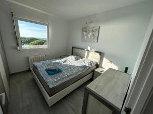 Ένα ή περισσότερα κρεβάτια σε δωμάτιο στο Apartment direkt am Strand +34 φωτογραφίες
