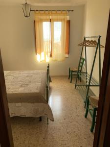 A bed or beds in a room at La Mandola