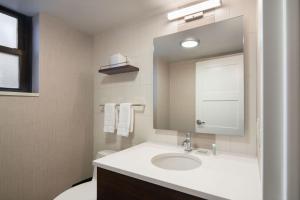 a bathroom with a sink and a mirror at Residence Inn by Marriott New York Manhattan/ Midtown Eastside in New York +44 photos