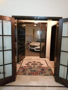a view from the hallway of a house with a car at Dream Inn Guest House in Islamabad