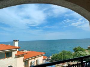 a view of the ocean from a balcony at Apartment Sunny in Casa Del Mare in Varna City