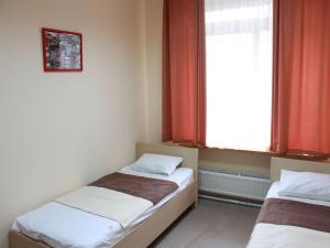 Posteľ alebo postele v izbe v ubytovaní Hostel Podolski Plus