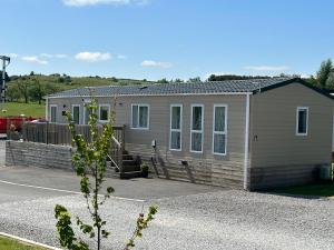 a small house in a parking lot at Luxury Lake District Holiday Home-Sleeps 4 in Cockermouth