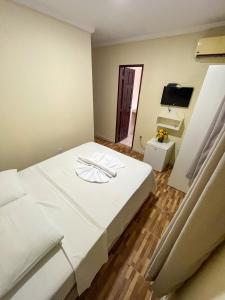 Кровать или кровати в номере Pousada Recanto de Ponta Negra