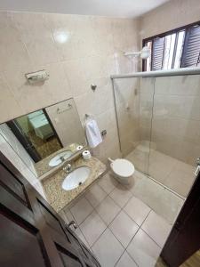 Ett badrum på Pousada Recanto de Ponta Negra