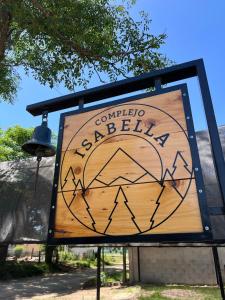 a sign for a basketball park with a bell at COMPLEJO ISABELLA in Villa Amancay