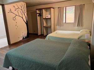 Cama o camas de una habitación en Hotel Tajalin
