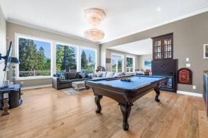 a large living room with a pool table at Upstairs Suite in Nanaimo Spacious 3-Bed Hideaway in Nanaimo