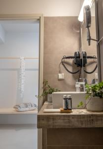 a kitchen with a sink and a phone on a counter at Scorpios Beach in Monolithos
