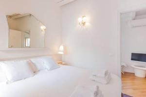 Letto o letti in una camera di Di punto in bianco home