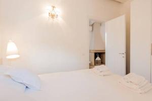 Letto o letti in una camera di Di punto in bianco home