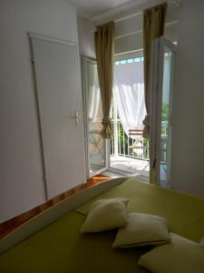 Postel nebo postele na pokoji v ubytování SOBE ŠOTIĆ