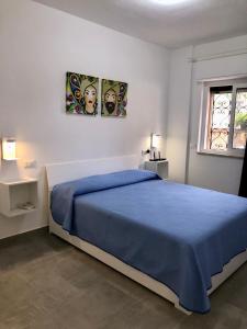 Postel nebo postele na pokoji v ubytování Casa Vacanze La Casa di Maria