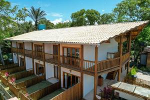 une image d'une maison avec toit dans l'établissement Flat em Taipu de Fora - Cond Vila Taipu, à Barra Grande