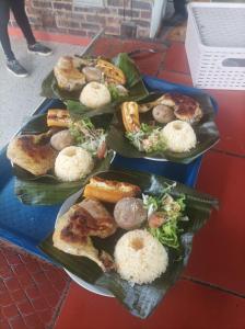 a table with three plates of food on it at Finca Agua Viva in Viotá