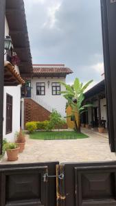 a building with a gate in front of a courtyard at Casa Tequio in San Crist&oacute;bal de Las Casas