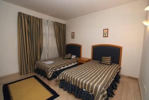 Letto o letti in una camera di Elba Luxury Villa