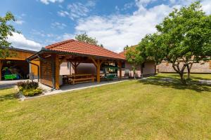 a gazebo in the backyard of a house at Apartments for families with children Karlovac - 20989 in Karlovac