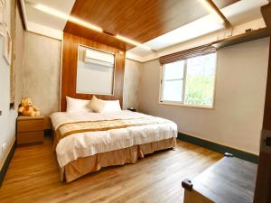 Uma cama ou camas num quarto em Yu Hsuan Homestay