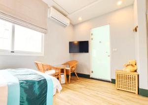 Uma cama ou camas num quarto em Yu Hsuan Homestay