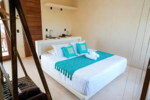 Postel nebo postele na pokoji v ubytování Tikul Hotel Boutique