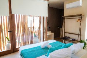 Postel nebo postele na pokoji v ubytování Tikul Hotel Boutique